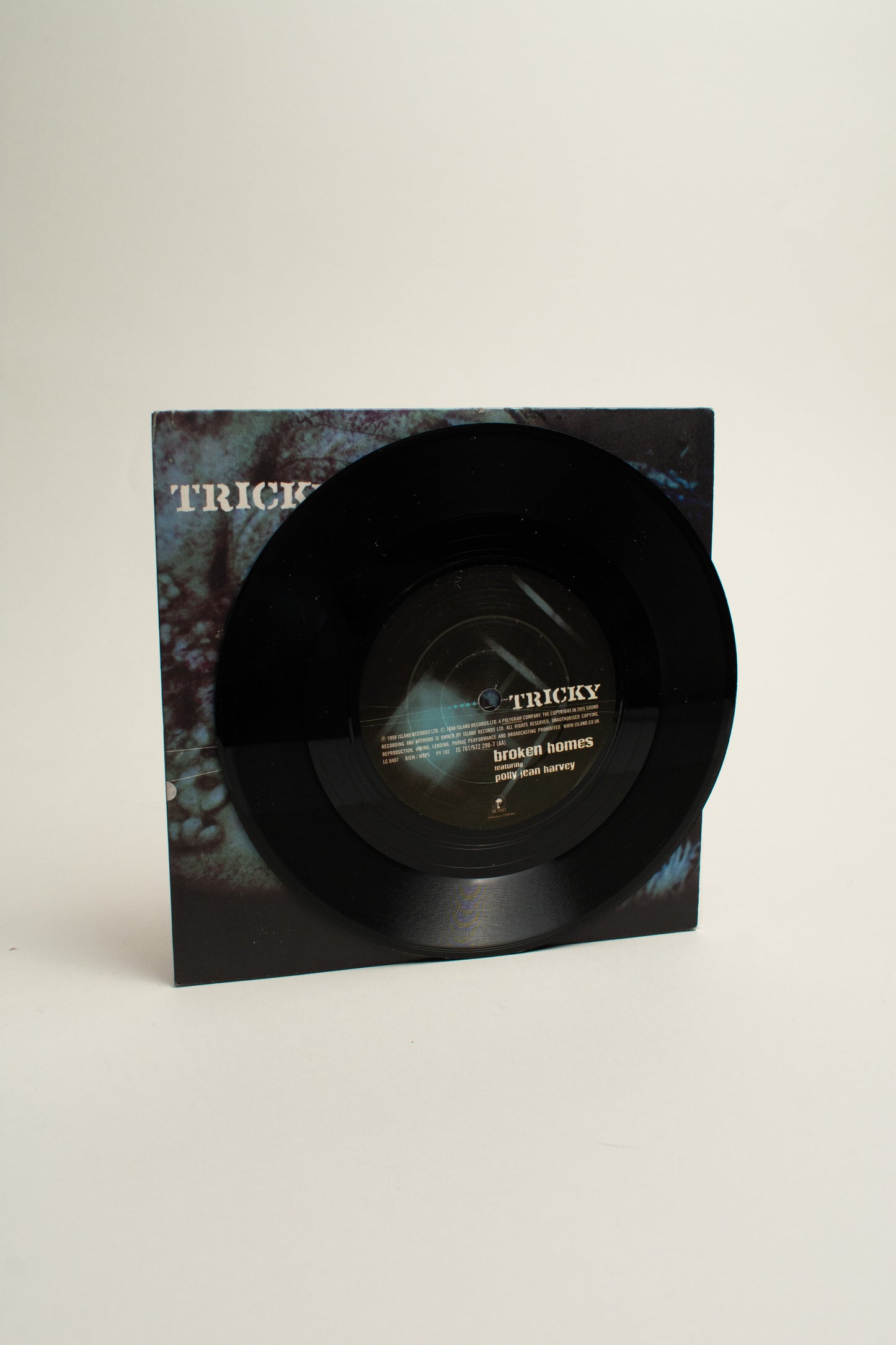 Tricky Featuring Polly Jean Harvey – Money Greedy / Broken Homes (UK, 7", 1998)